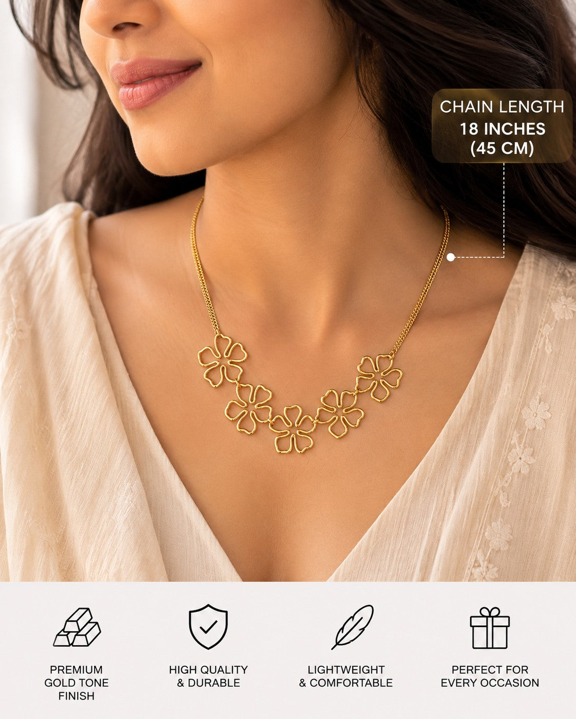 Five-flower gold-tone necklace styled with a cream blouse