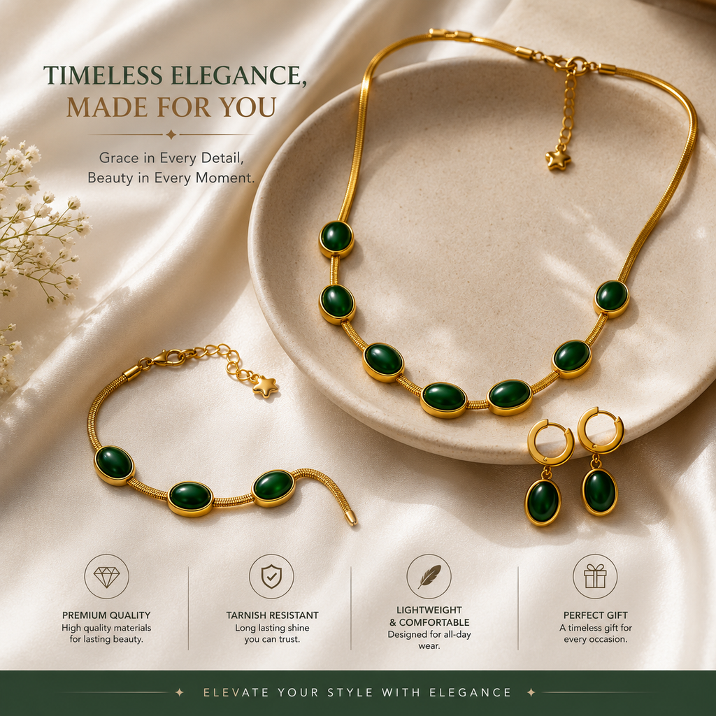 Green oval gold-tone necklace, bracelet and earrings arranged on cream fabric and a tray