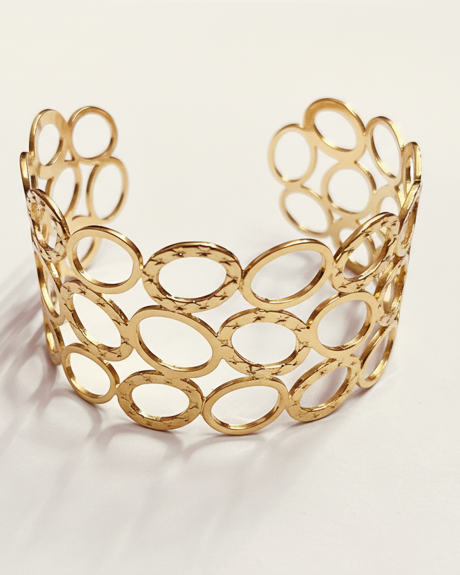 Gold Openwork Cuff Bracelet on White Background