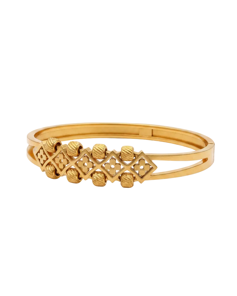 Gold geometric bangle bracelet on white background