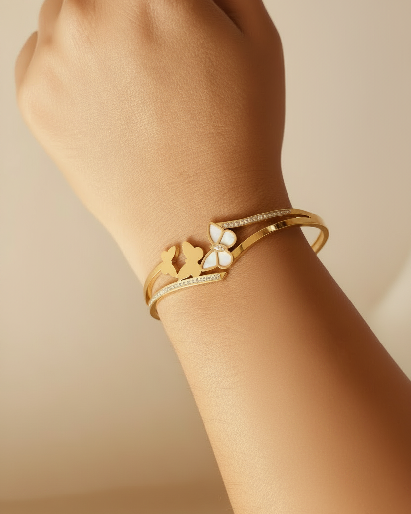 Gold double butterfly duo bangle bracelet lifestyle shot