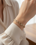 Model wearing gold infinity diamond cuff bracelet