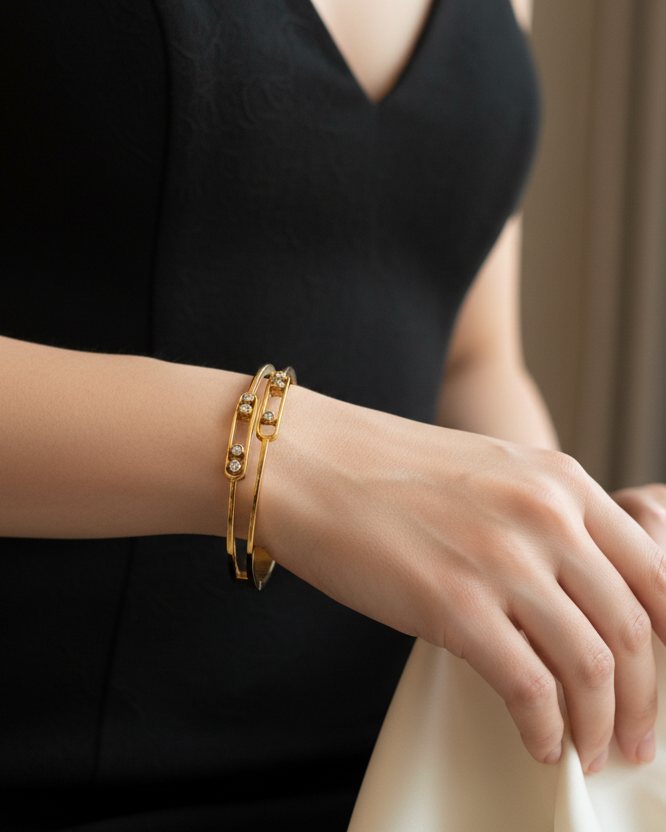 Model wearing gold diamond bangle bracelet