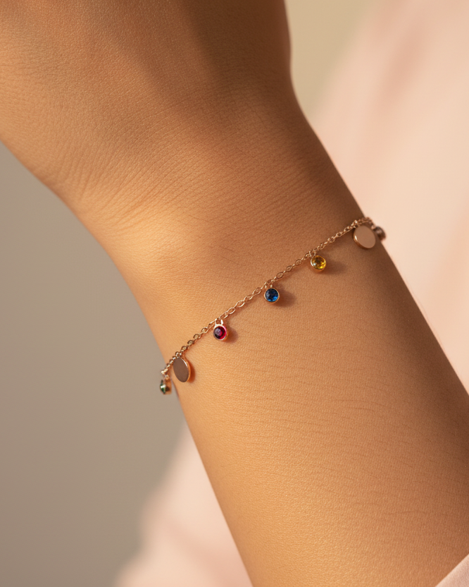 Rose gold disc and gemstone charm chain bracelet lifestyle shot worn on wrist