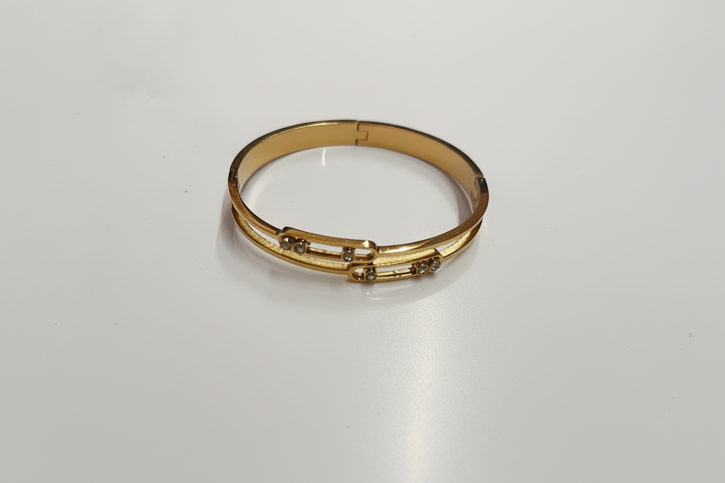 Gold diamond bangle bracelet on white background