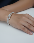 Silver pavé crystal baguette bangle bracelet lifestyle shot worn on wrist